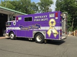 Firefighters Sport Purple Fire Trucks to Support Girl with Cancer