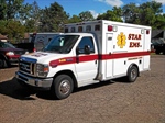 Three Injured Following Ambulance Collision in Highland Township