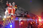 Santa Rolls into Lincolnwood (IL) Holiday Lights Festival on Fire Apparatus