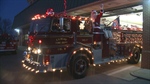 Santa trades his sleigh for a fire truck