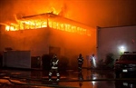 Flames spew from California fire station while crew is away