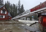 CA Firefighters Use Ladder Truck to Rescue Nine Trapped by River Swell