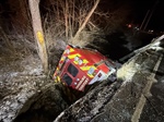 Ambulance Slides Off Icy Road, Overturns Into Creek