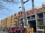 Firefighters Rescue Construction Worker with Ladder Truck After Fall