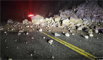 Rockslide hits pickup pulling a camper near Asotin