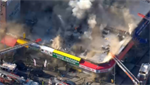 VIDEOS: Fire tears through building housing row of businesses in New York