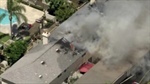 VIDEOS: Crews battle fire that spread to apartment complex in Los Angeles