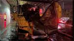 Sprinklers contained truck fire under carport as Vancouver firefighters cut gate to reach flames