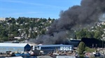 Over 100 firefighters battle large commercial warehouse fire in Ballard