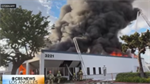 California firefighters battle third-alarm blaze at commercial building