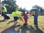 McAlester (OK) Volunteers Work with Fire Department to Paint Hydrants