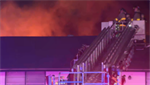 VIDEOS: Firefighter falls through floor as 3-alarm fire tears through vacant apartment building in Texas