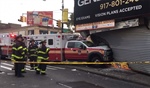 Injuries After Ambulance Crashes into Fordham (NY) Storefront