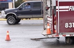 Gravel Truck Clips Evergreen (MT) Fire Apparatus at Accident Scene